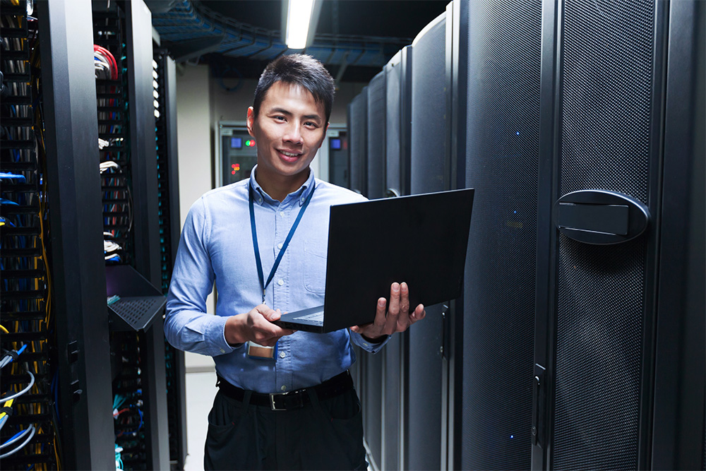 Technical operations specialist working in a server room