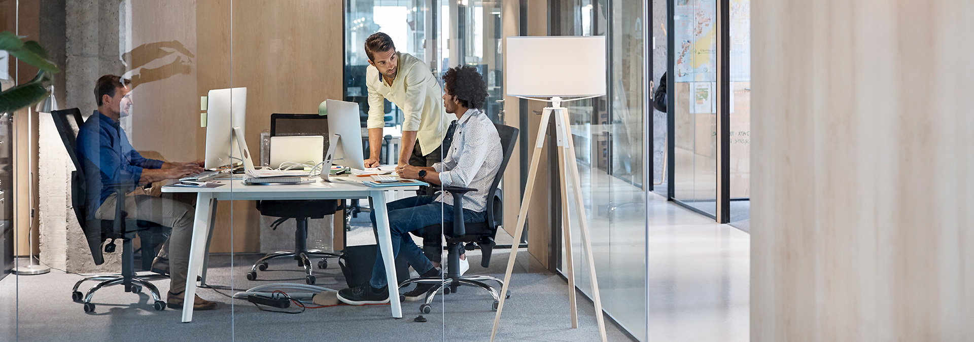 ALT Consulting team members collaborating in the office