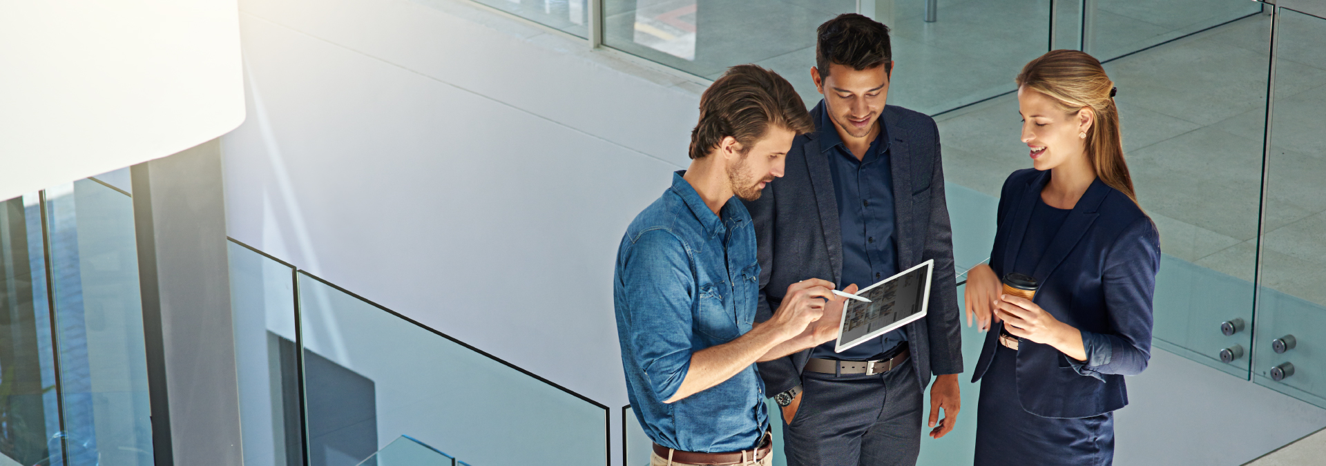 IT consultants reviewing a solution on a tablet