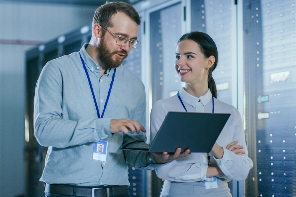 Information security specialists reviewing systems in a data center