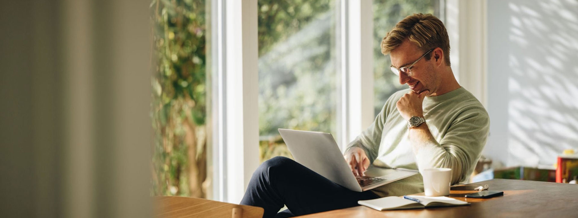 Law firm owner planning next steps on a laptop