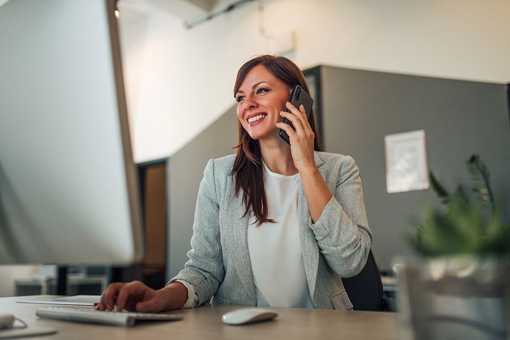 Legal staff member supported on a call at her desk