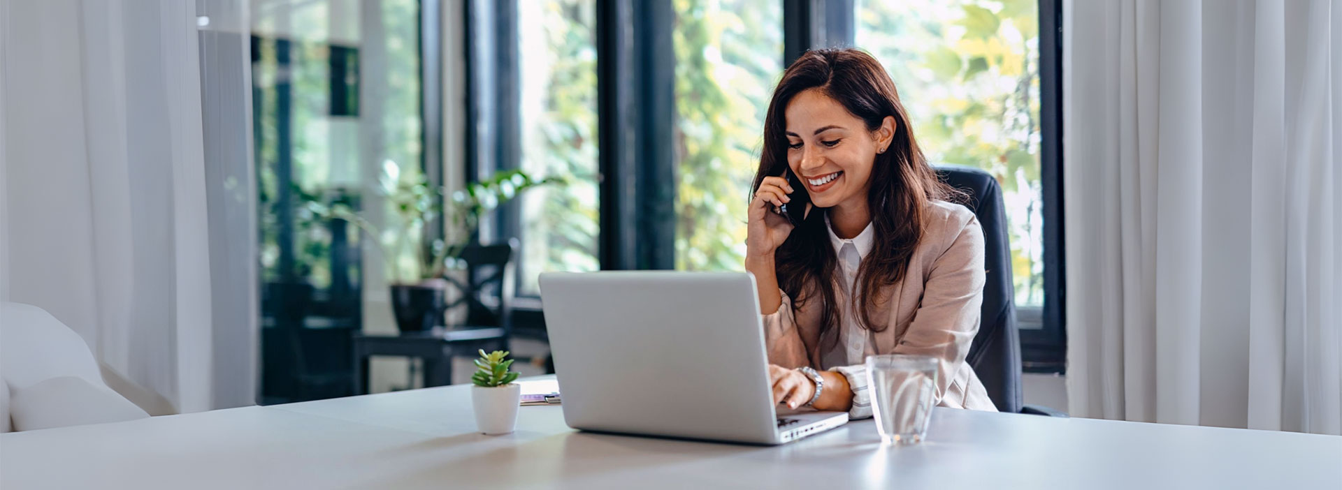 Attorney getting legal software advice over the phone at her desk