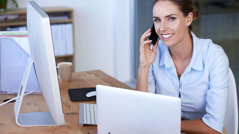 ALT support specialist taking a call at her desk