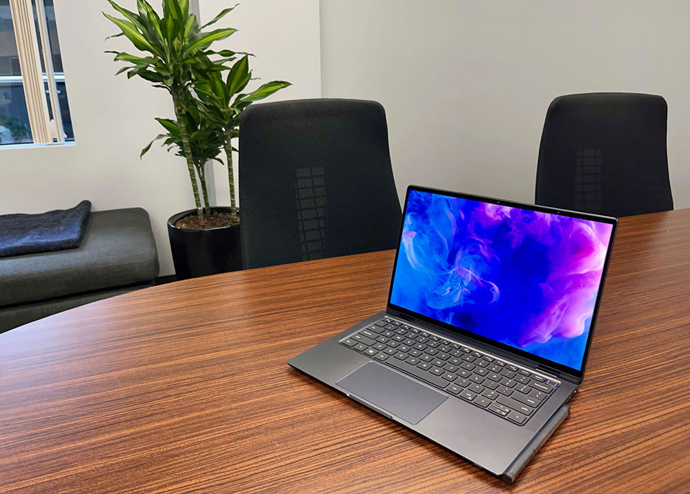 Business laptop on a law firm conference table