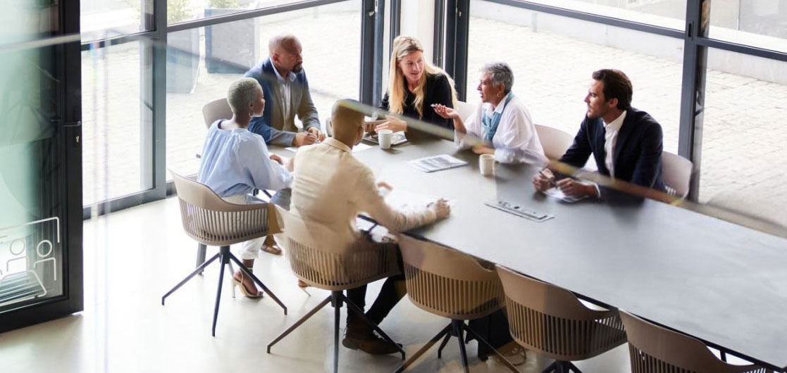 Firm leadership and IT reviewing the engagement in a boardroom